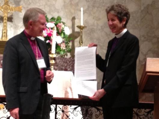 Church of Sweden Archbishop Anders Werjyd and Episcopal Church Presiding Bishop Katharine Jefferts Schori present their signed climate change statement at St. John's Episcopal Church in Washington, D.C. on May 1.